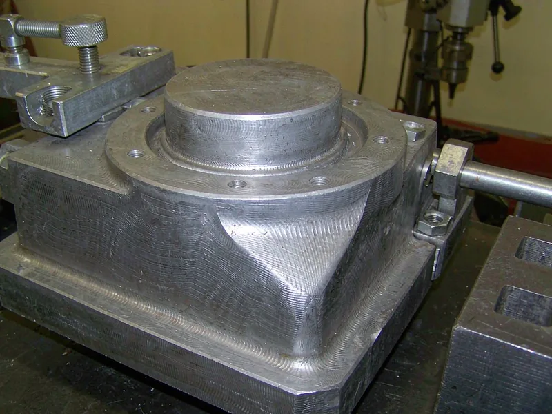 Textured aluminum die casting surface requiring extra draft angle